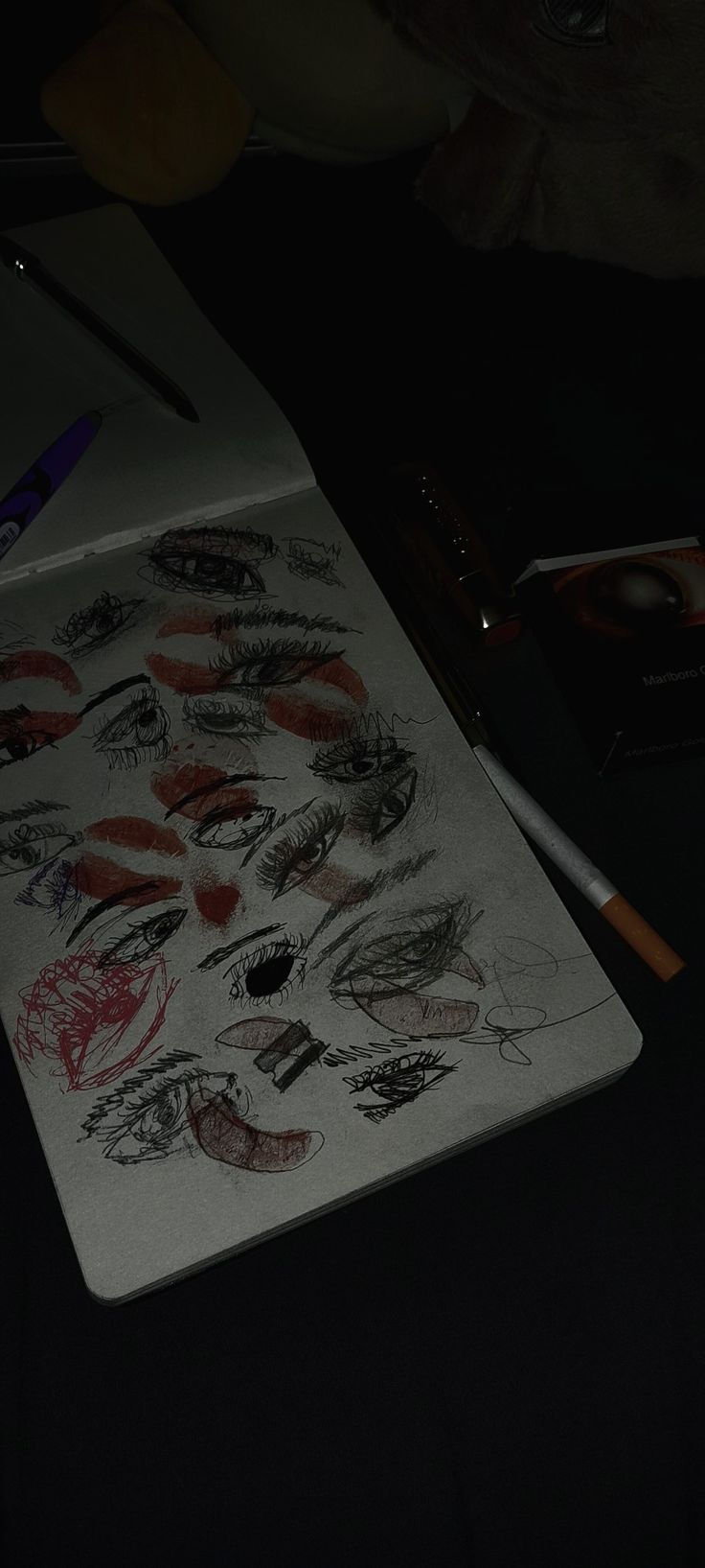 a drawing board with various lips drawn on it