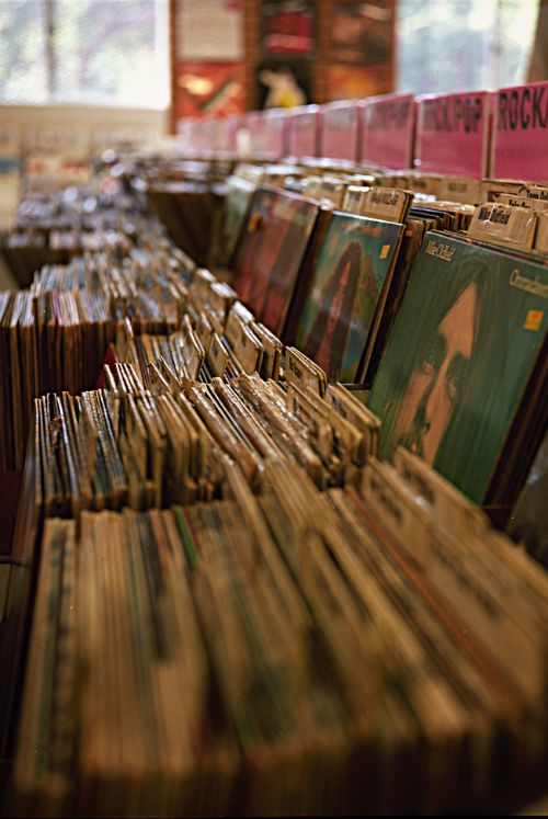 many records are stacked on top of each other