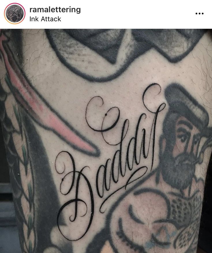 the back of a man's leg with tattoos on it and words written in cursive writing