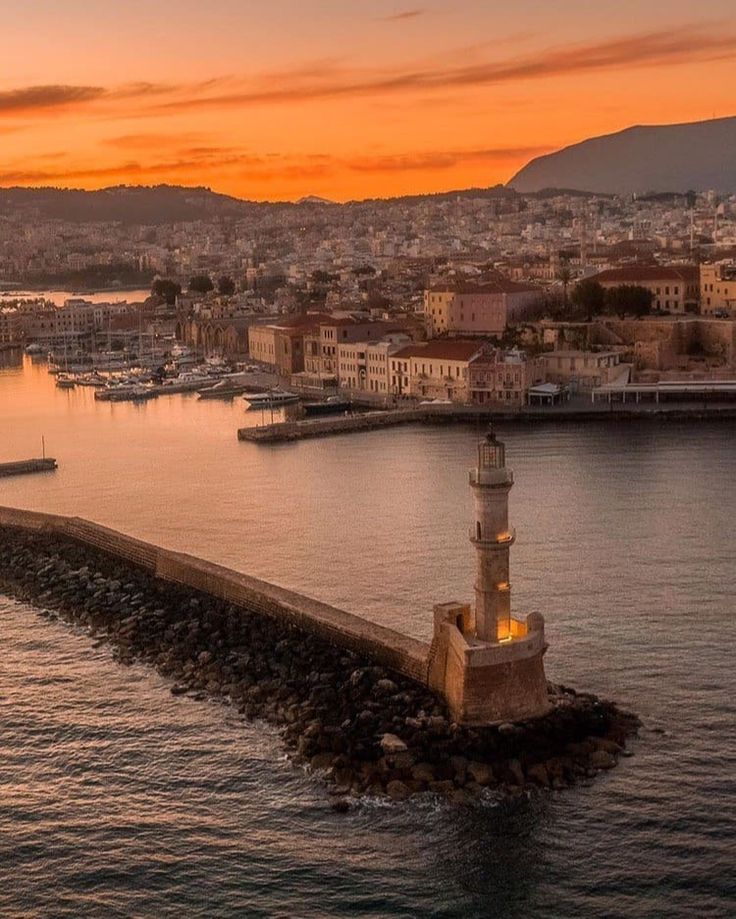 an aerial view of a harbor at sunset