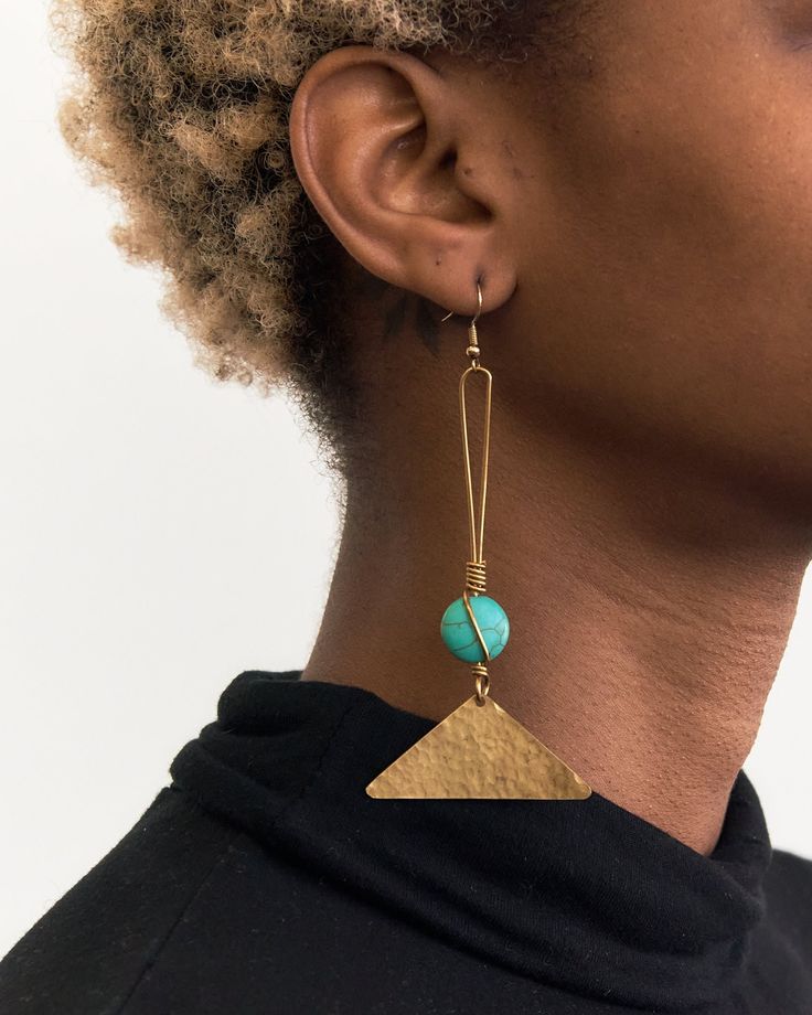 "Brass earrings handmade in Kenya. Sourced by Zahara Crafts.  A note from the vendor: Zahara, in our native language Kiswahili, means \"to flower or to bloom.\" We exist to empower and sustain the longevity of East African craftsmanship & the livelihoods of these communities as we bridge the gap between Kenyan artisans and individuals in the Diaspora.  Our products, though contemporary, exist to pay homage to Kenyan culture, customs & traditions rooted in Maasai-themed products and beadwork prac Artisan Teardrop Single Earring, Artisan Single Teardrop Earring, Fair Trade Turquoise Jewelry Gift, Turquoise Fair Trade Jewelry For Gifts, Bohemian Brass Linear Earrings For Pierced Ears, Bohemian Brass Linear Earrings For Gift, Fair Trade Adjustable Earrings, Bohemian Brass Wrap Earrings As Gift, Artisan Dangle Wrap Earrings As Gift