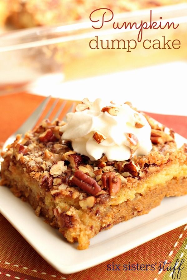 pumpkin dump cake on a plate with whipped cream and pecans in the background, text overlay