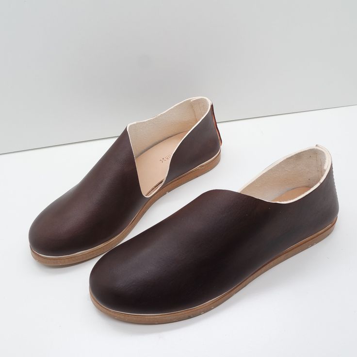 The Keiko is a translation of our most popular Sandy style to this much more casual roundtoe. A stitched back and roomy front, along with a rubberized sole make it a go to style for many occasions. This style features a removeable insert. The foam layer can be removed/replaced for a wider fitting shoe (we suggest to glue down the leather layer). Our new method of shoemaking has a double layer stitched back seam to provide heel structure without gripping the ankle. Made with our own olive leaf ta Comfortable Flat Leather Shoes With Stitched Sole, Brown Leather Sole Loafers For Everyday, Everyday Brown Loafers With Leather Sole, Slip-ons With Contrast Sole And Closed Toe, Slip-on Round Toe Moccasins For Everyday Wear, Brown Flats With Rubber Sole For Everyday, Everyday Flats With Stitched Sole, Brown Loafers With Contrast Sole And Round Toe, Leather Loafers With Stitched Sole For Everyday