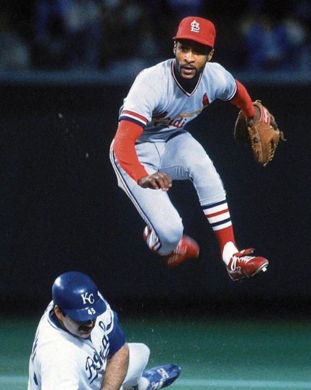 a baseball player sliding into home plate