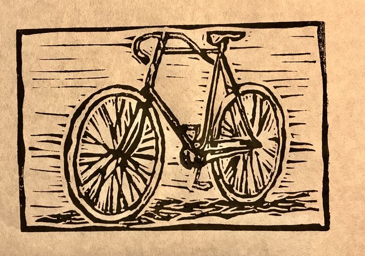 a drawing of a bicycle on brown paper