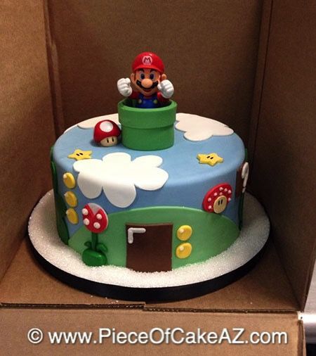 there is a cake in the shape of a mario bros mushroom house on top of a cardboard box