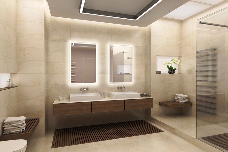 a bathroom with two sinks and a shower