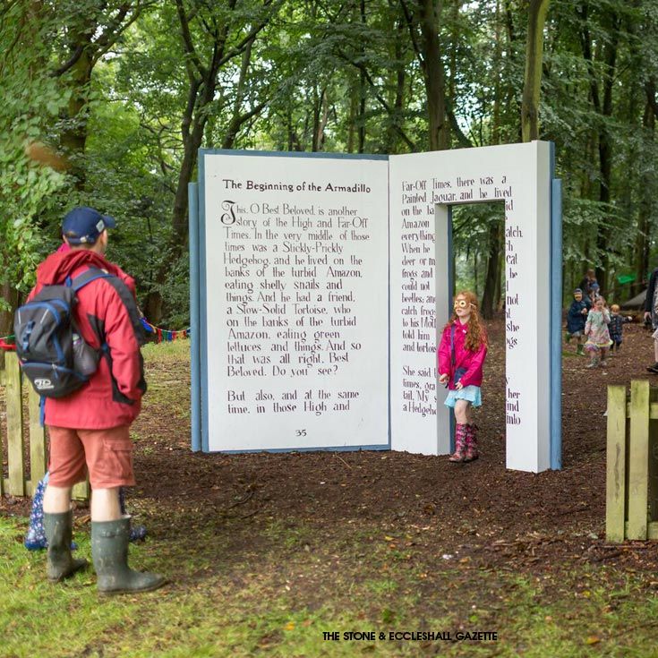 two children are standing in front of a sign with an open door and poem on it