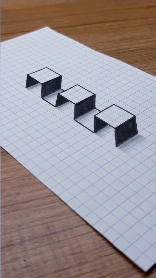 three rectangular shapes are placed on top of a sheet of paper