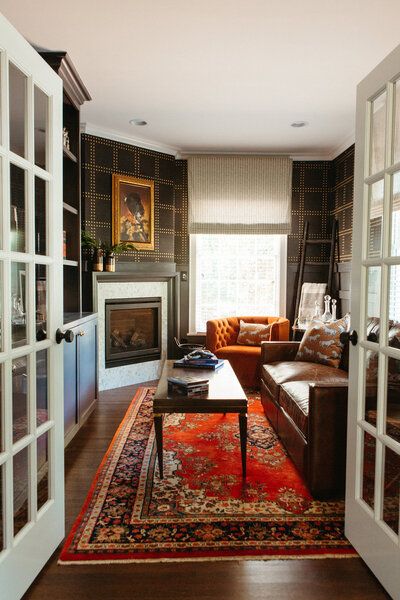 a living room filled with furniture and a fire place