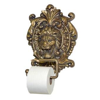 a toilet paper holder with a lion head on it's face and scrolled design