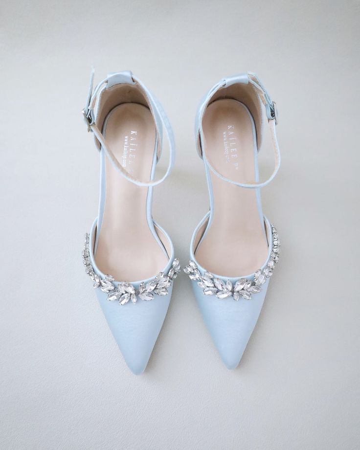 Shop our women shoes collection in glitter, satin and lace. Comfortable wear for bridal party, formal wear, night out and weddings. FREE SHIPPING IN U.S FOR ORDERS $100 AND MORE! Glamorous Embellished Satin Heels, Satin Heels With Rhinestones For Prom, Satin Heels With Rhinestones And Pointed Toe, Glamorous Satin Wedding Heels, Wedding Crystal Heels With Ankle Strap, Crystal Ankle Strap Heels For Wedding, Bedazzled High Heel Wedding Heels, Bedazzled High Heels For Wedding, Satin Heels With Rhinestones For Wedding