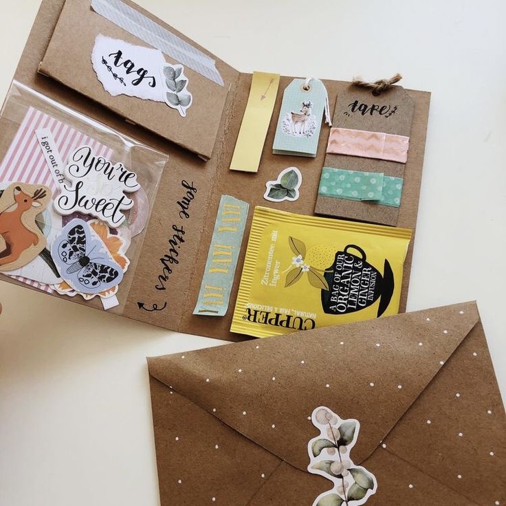 an open brown envelope with stickers on it