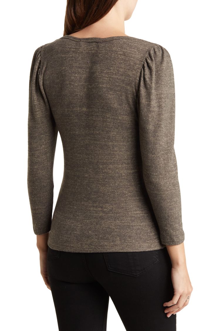 Go casual in this lightweight knit top fashioned with a rounded V-neck and gently puffed shoulders. 24" length V-neck Three-quarter sleeves 95% rayon, 5% spandex Machine wash, line dry Made in the USA Model stats: 5'10" height, 32" bust, 25" waist, 36" hip. Model is wearing size Small. Stretch Puff Sleeve Top For Fall, Fitted Textured Knit Top For Fall, Textured Knit Fitted Top For Fall, Chic Puff Sleeve Knit Top For Fall, Chic Fall Knit Top With Puff Sleeves, Knit Tops With Balloon Sleeves For Fall, Fitted Top With Blouson Sleeves And Crew Neck, Fitted Puff Sleeve Top For Fall, Stretch Crew Neck Puff Sleeve Top For Fall