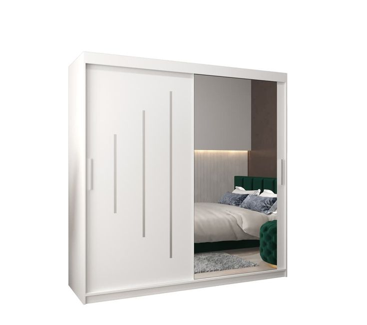 an open white closet with a bed in it