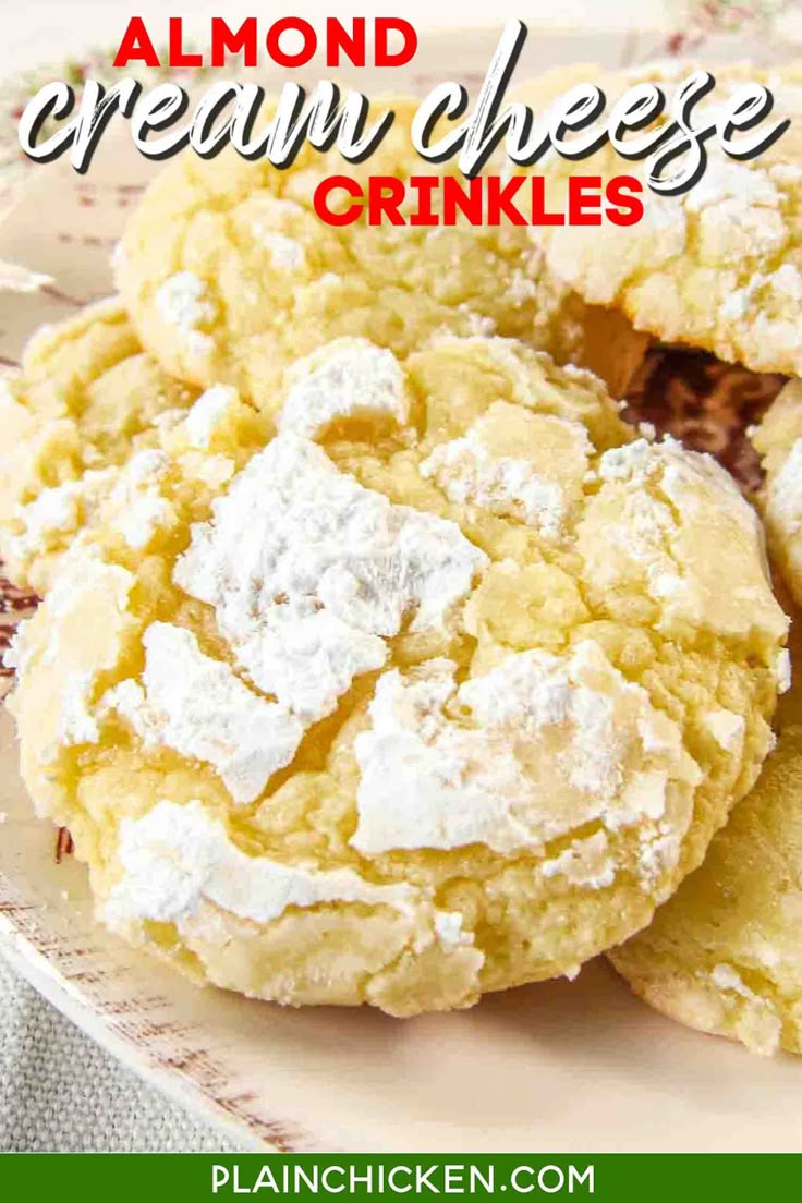 there is a plate with some cookies on it and the words almond cream cheese crinkles