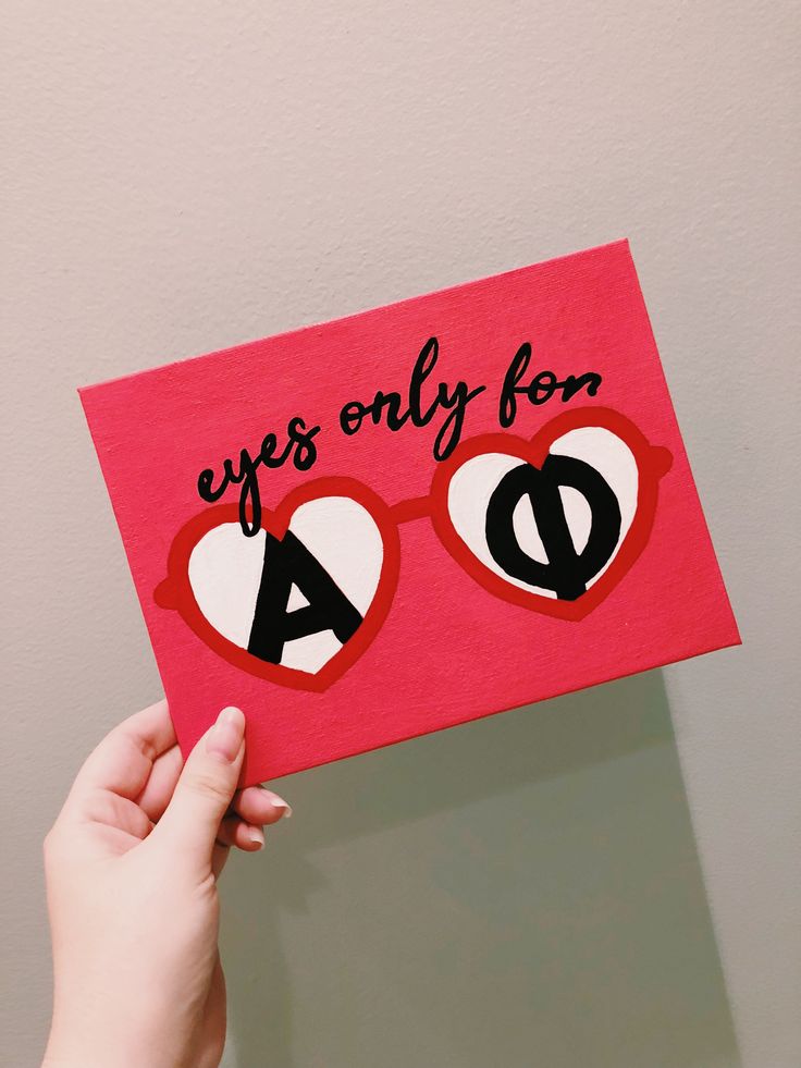 someone is holding up a card with the words eyes only for a d on it