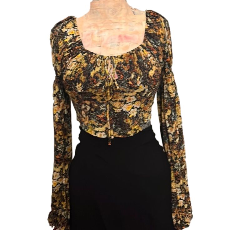 Nwt Long Sleeve Black Crop Top With Autumn Tone Floral Pattern Low Cut Drawstring Tie In Front To Adjust Neckline Elastic Cuffs On Sleeves Stretchy Soft Fabric Smocking In Back Urban Outfitters Xsmall Ptp14, Length14 Small Ptp14.5, Length15 Medium Ptp15, Length16 Urban Outfitters Fitted Floral Print Tops, Fitted Urban Outfitters Floral Print Tops, Fitted Floral Print Top From Urban Outfitters, Fitted Floral Print Tops By Urban Outfitters, Urban Outfitters Bohemian Fitted Tops, Bohemian Fitted Top From Urban Outfitters, Fitted Bohemian Top From Urban Outfitters, Fitted Bohemian Orange Crop Top, Fitted Fall Blouse From Urban Outfitters