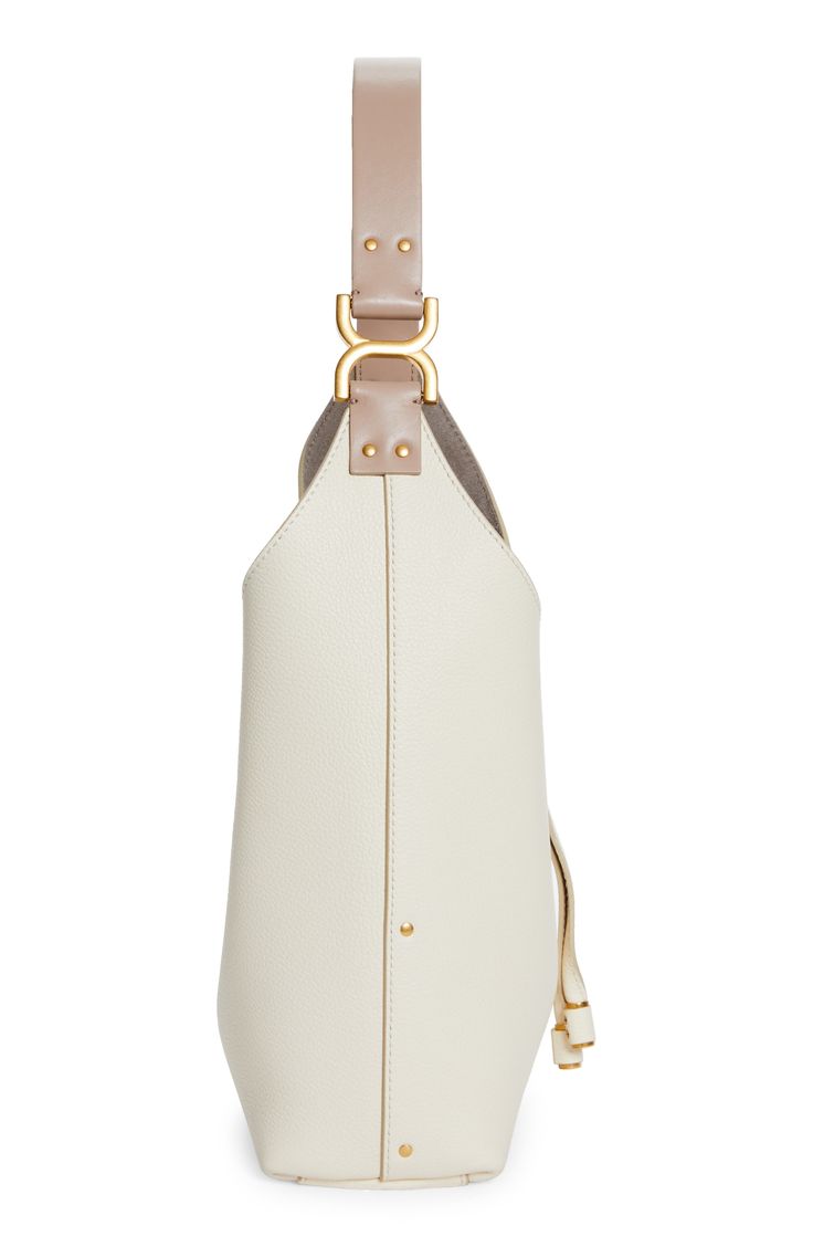 This slouchy calfskin-leather hobo bag blends a modern aesthetic with a '70s folk spirit, and of course has the Marcie line's signature slip-tassel closure. Tassel closure Shoulder strap Interior zip pocket Leather Made in Italy Designer Handbags This brand has B Corp certification, representing business practices with emphasis on social and environmental performance, accountability and transparency This brand meets Nordstrom Responsible Brands criteria: brand adheres to responsible social and e Designer White Leather Bucket Bag, Designer Bucket Hobo Bag With Gold-tone Hardware, Beige Leather Hobo Bag With Top Handle, Leather Hobo Bag With Detachable Strap In Beige, Beige Leather Hobo Bag With Adjustable Strap, Modern Beige Hobo Bag With Detachable Strap, Luxury Cream Leather Hobo Bag, Luxury Beige Hobo Bag In Soft Leather, Luxury Beige Soft Leather Hobo Bag