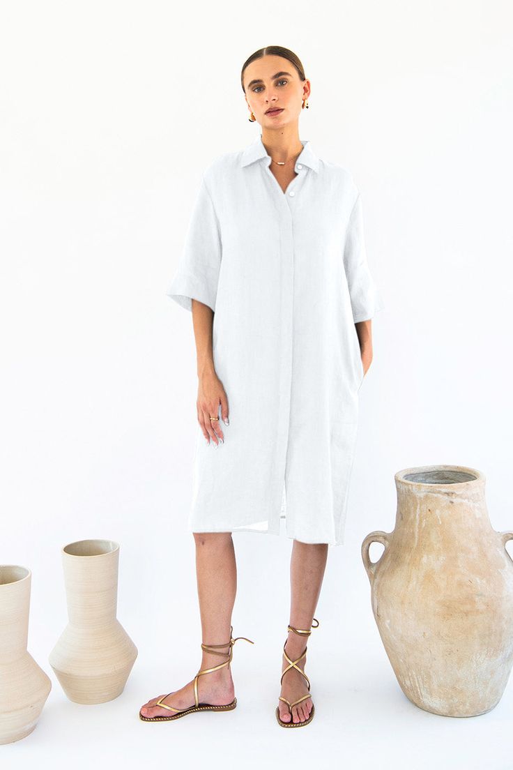 Designed for those who appreciate effortless style and comfort, this dress is a timeless addition to any wardrobe.Crafted from luxurious 100% linen, this shirt dress offers a lightweight and breathable feel, perfect for warm days or layering during cooler evenings. The button-front design exudes classic sophistication, while the sleeves hitting at the elbows add a touch of modern flair.Featuring a shirt collar that lends a polished finish, this dress effortlessly transitions from day to night, making it a versatile staple for any occasion. Whether you're running errands, meeting friends for brunch, or attending a casual gathering, the Neu Nomads Chloe Shirt Dress is sure to turn heads.Pair it with sandals for a relaxed daytime look, or dress it up with heels and statement accessories for a Chic Linen Dress For Daywear, Relaxed Linen Vacation Dresses, Relaxed Linen Summer Dress, Relaxed Linen Dress For Vacation, Elegant Linen Tunic Dress For Spring, Beach Linen Button-up Dress, Linen Button-up Beach Dress, Chic Button-up Linen Dress For Daywear, Beach Button-up Linen Dress