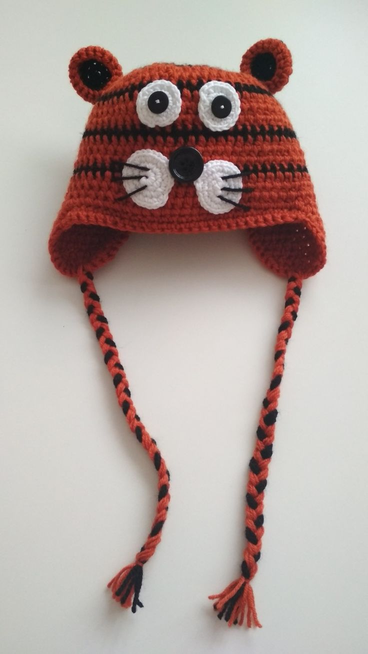 a crocheted hat with an animal face on it