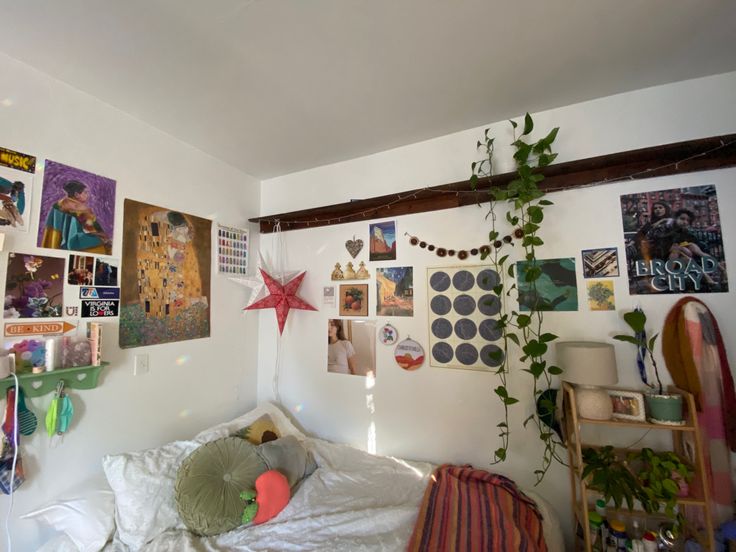 a bedroom with many pictures on the wall