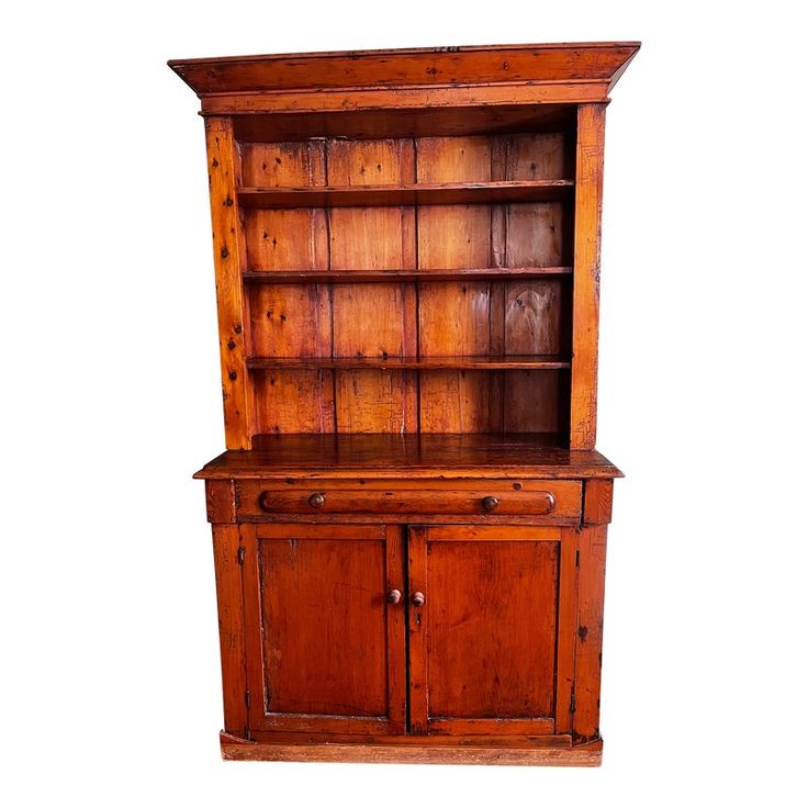 an old wooden hutch with two doors and one drawer on the front, isolated against a white background