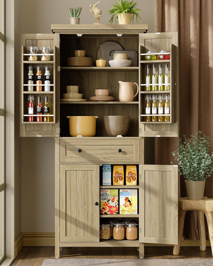 an open cabinet with spices and condiments in it next to a small potted plant