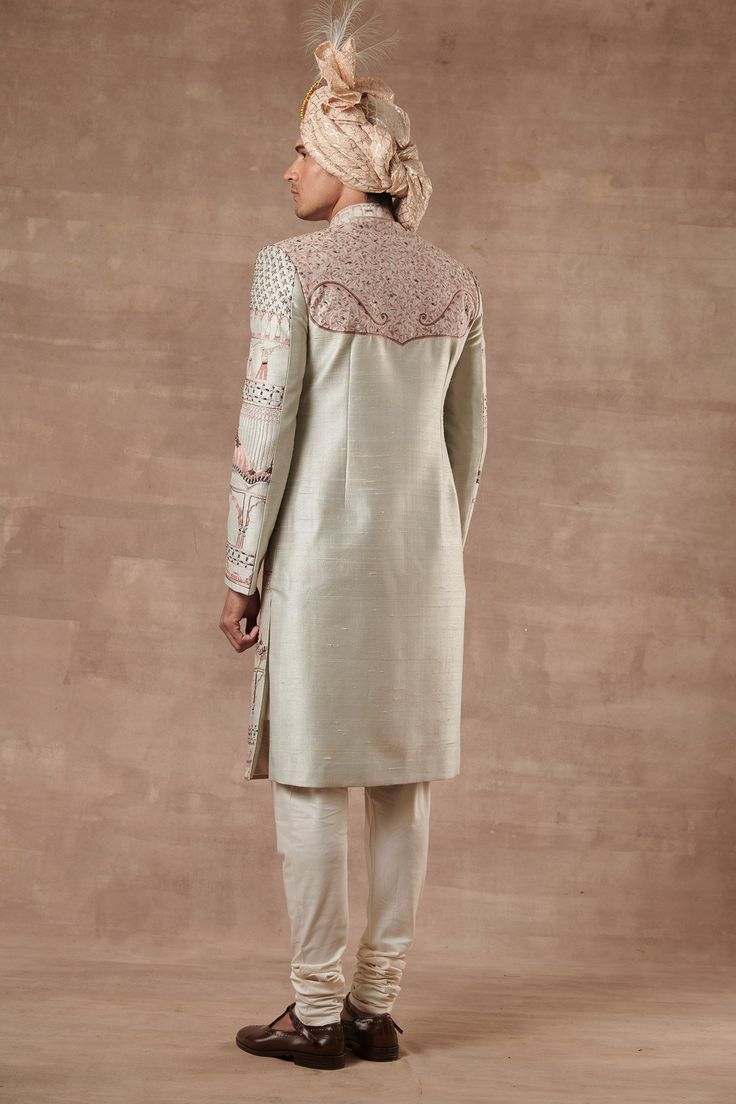 Grey sherwani with Mughal embroidered motifs and mandarin collar. Paired with kurta and pyjama.
Components:3
Pattern:Embroidered
Type of Work:Mughal
Neckline:Mandarin
Sleeve Length:Full Sleeves
Fabric:Raw Silk, Cotton Silk
Color:Grey
Other Details:
Note: Head accessory worn by the model is not for sale
Occasion:Groom, Wedding - Aza Fashions Grey Sherwani, Embroidered Sherwani, Cute Celebrity Couples, Embroidered Motifs, Head Accessories, Full Sleeves, Embroidered Silk, Raw Silk, Celebrity Couples