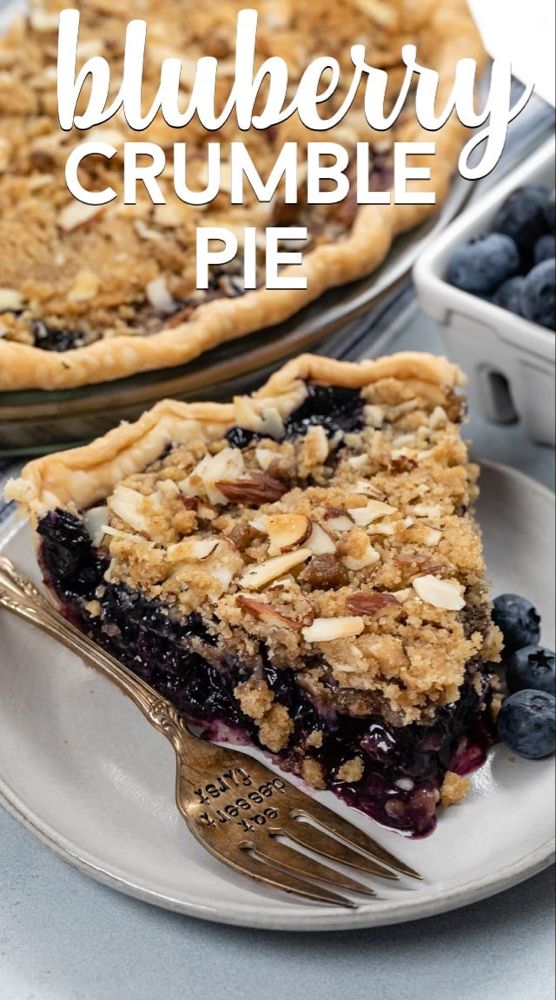 blueberry crumble pie on a plate with a fork