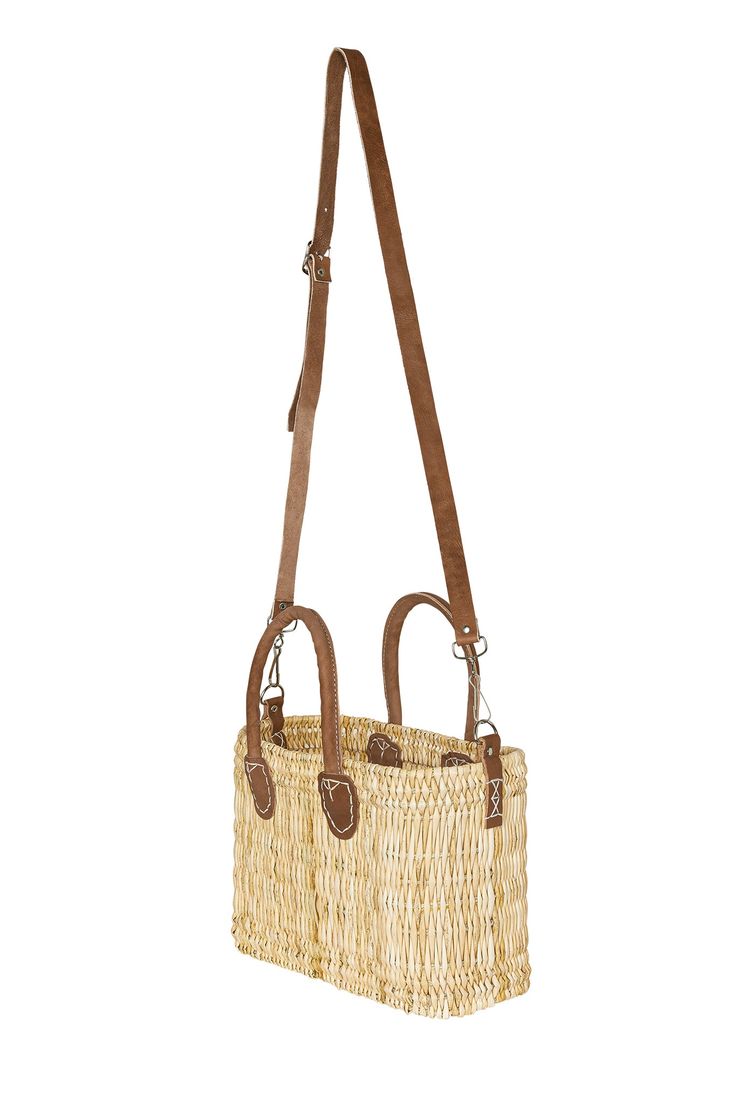 The cutest little bag Inspired by the breathtaking aesthetic of Lake Como, our structured, hand-woven beach bag is accentuated with leather handles, a leather shoulder strap, and gold hardware. Perfect for all beach needs, it can go from sand to supper, and everything in between: shopping, traveling, you name it! We particularly love this bag for its added adjustable leather shoulder strap.Features:Structured mini straw bag Hand-woven seagrass constructionAdjustable shoulder strapArtisan leather Beach Needs, Monday Swimwear, Detail Shop, Lake Como, Woven Bag, Leather Handles, Name It, Beach Bag, Small Bags