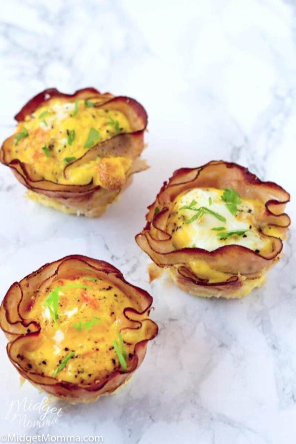 three small appetizers are sitting on a marble surface