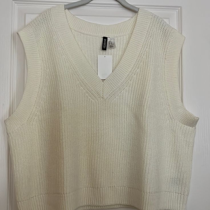 Brand New Cream Knitted Vest H&m Knit V-neck Top, H&m Knitted Tops For Spring, H&m Knit Tops For Fall, Fall Knit Tops By H&m, H&m Knitted Sweater, Fall Knitted Tops From H&m, H&m Casual Textured Knit Sweater, H&m V-neck Sweater For Spring, H&m Fitted V-neck Sweater