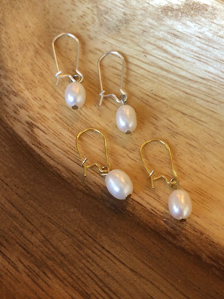 Simple and dainty freshwater pearl earrings. Available in sterling silver or 18k gold plated. Elegant Everyday Teardrop Earrings In 14k Gold Filled, Everyday Pearl Drop Jewelry, Elegant 14k Gold Filled Teardrop Earrings, Everyday Drop Pearl Jewelry, Everyday Teardrop Earrings With Pearl Charm, Elegant Earrings With Pearl Charm For Everyday, Dainty Dangle Pearl Earrings With Ear Wire, Elegant Everyday Earrings With Pearl Charm, Elegant Adjustable Nickel-free Teardrop Earrings