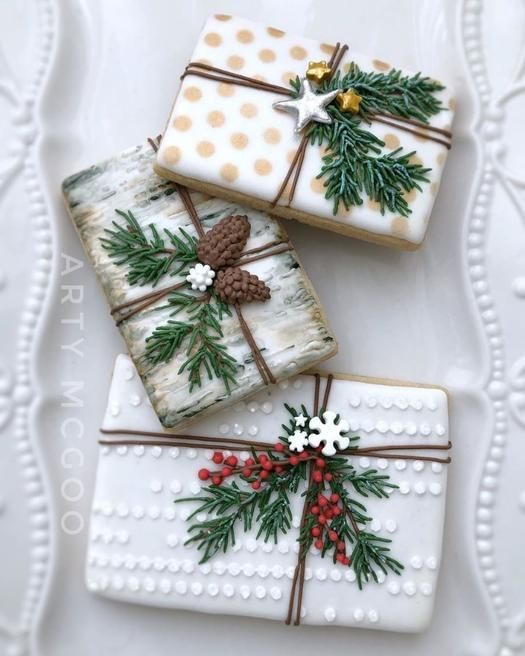 three decorated christmas gifts on a white plate