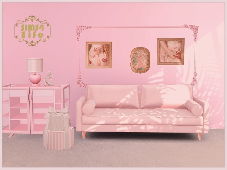 a living room with pink furniture and pictures on the wall above it's headboard