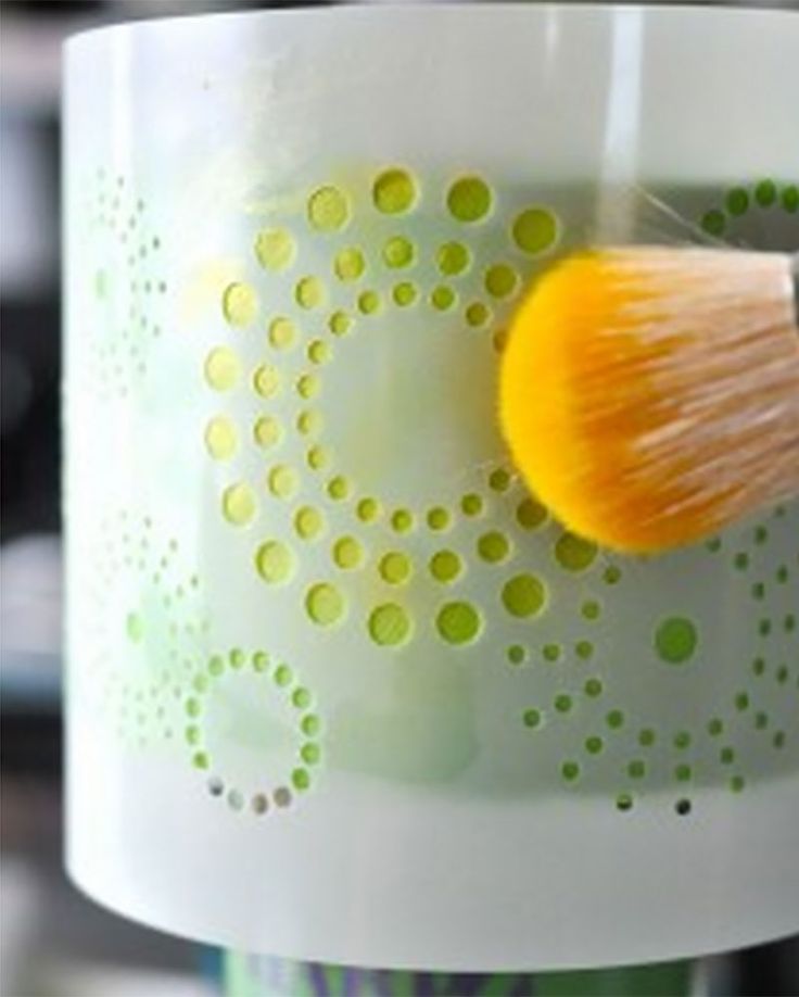 a close up of a cup with a brush in it