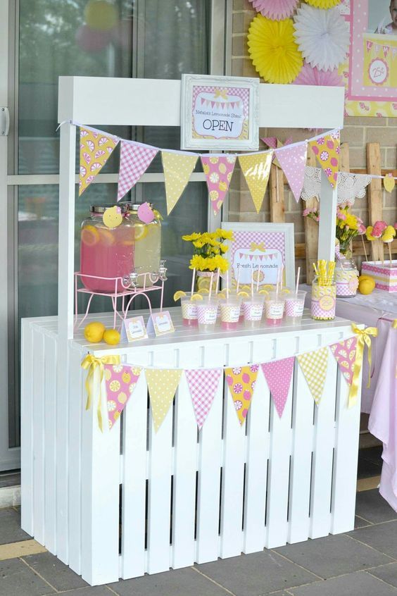 a pink and yellow birthday party with decorations