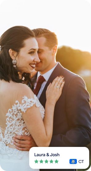 a bride and groom embracing each other in front of the sun