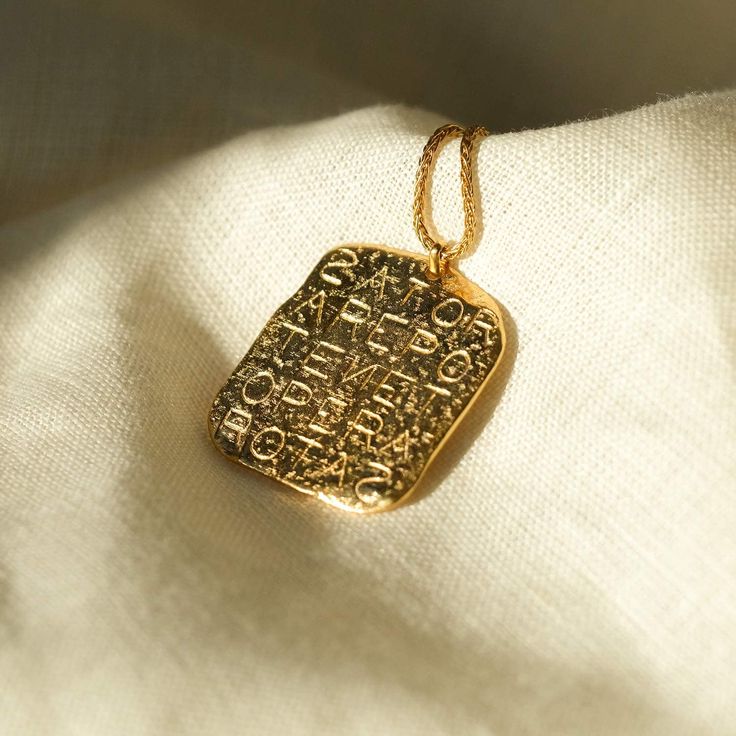 Magic Sator Square Gold Talisman Necklace - COMMON ERA Gold Rectangular Pendant Necklace Collectible, Gold Rectangular Pendant Necklace For Collectors, Antique Gold Necklace With Rectangular Pendant, Ancient Style Engraved Yellow Gold Necklaces, Gold Ancient Style Engraved Necklace, Symbolic Square Pendant Necklace With Engraving, Ancient Style Gold Engraved Necklace, Antique Engraved Jewelry For Good Luck, Ancient Style Engraved Gold Necklace