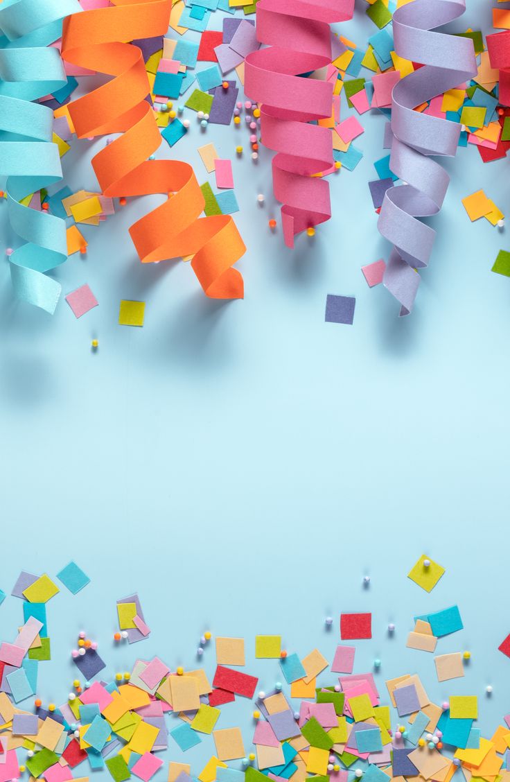 colorful streamers and confetti on a blue background