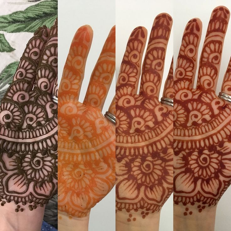 two hands with henna designs on them, one is orange and the other is brown