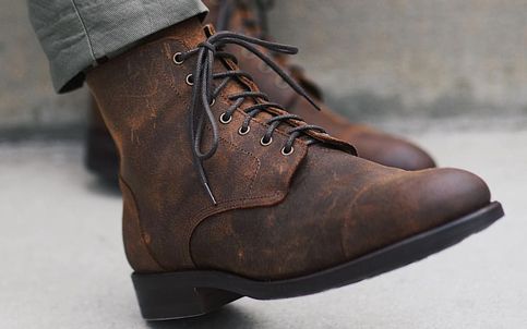 Luxury Leather Work Boots For Streetwear, Luxury Leather Work Boots For Fall, Luxury Brown Rugged Combat Boots, Luxury Lace-up Work Boots For Fall, Luxury Lace-up Boots For Workwear, Luxury Casual Plain Toe Lace-up Boots, Luxury Lace-up Workwear Boots, Luxury Lace-up Casual Boots, Luxury Leather Footbed Lace-up Boots For Work