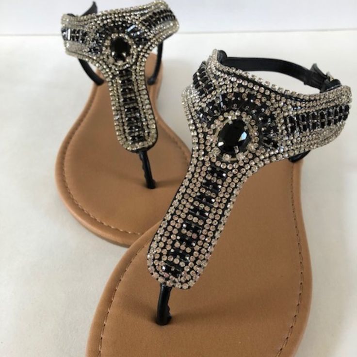 This Beautiful Sandal Will Compliment Any Outfit! Black And Diamond Colored Rhinestones Make This One A Real Show-Stopper! Adjustable Rhinestone Sandals For Party, Evening Sandals With Rhinestones, Adjustable Fit, Evening Sandals With Embellished Adjustable Straps, Silver Bedazzled Flat Sandals, Adjustable Embellished Silver Sandals, Embellished Adjustable Sandals For Evening, Adjustable Embellished Sandals For Evening, Glamorous Adjustable Embellished Sandals, Silver Embellished Flat Sandals