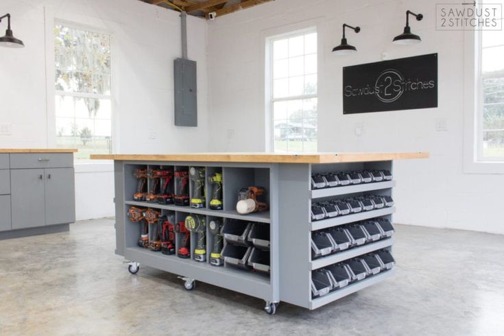 a large workbench with lots of tools on it in the middle of a room