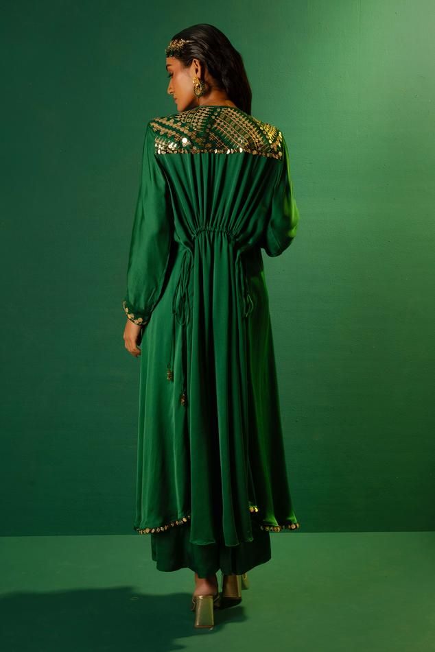 Emerald green placement sequin mirror hand embroidered kurta with high-low hem. Paired with a palazzo.
Components: 2
Pattern: Hand Embroidery
Type Of Work: Sequins
Neckline: Round Neck
Sleeve Type: Full Sleeves
Fabric: Satin
Color: Green
Other Details: 
Note: All the jewellery, belt and potli bag shown in the image is not for sale
Occasion: Sangeet - Aza Fashions Kurta With Palazzo, Jewellery Belt, Potli Bag, Satin Hands, Satin Color, Green Satin, Full Sleeves, Aza Fashion, Fashion Set