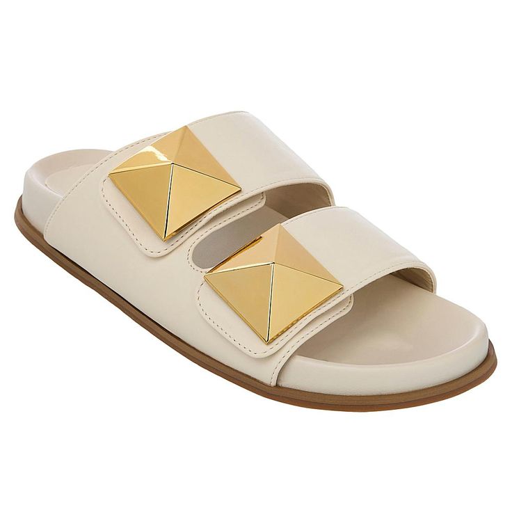 SHUSHOP BERNARDA Pyramid Slide Sandal The wide straps and molded footbeds of these slide sandals turn them into one of our most comfortable and sophisticated options for warm weather dressing. The oversized metallic studs can dress up any outfit.  Good to Know       Fit runs small, so we recommend going up a half-size. Beige Slide Footbed Sandals With Textured Footbed, Beige Slides With Textured Footbed, Cream Slides With Removable Insole And Round Toe, Cream Slides With Textured Footbed For Summer, Cream Slides With Cushioned Footbed, Modern Beige Slides For The Beach, Chic Cream Sandals With Textured Footbed, Modern Beige Slides For Beach, Beige Slide Mules With Cushioned Footbed