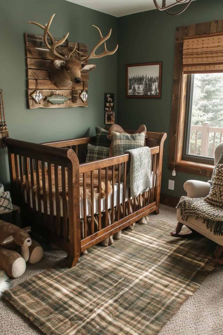 a baby's room with a deer head mounted on the wall and plaid rug