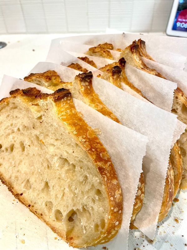 sliced loaf of bread sitting on top of a counter