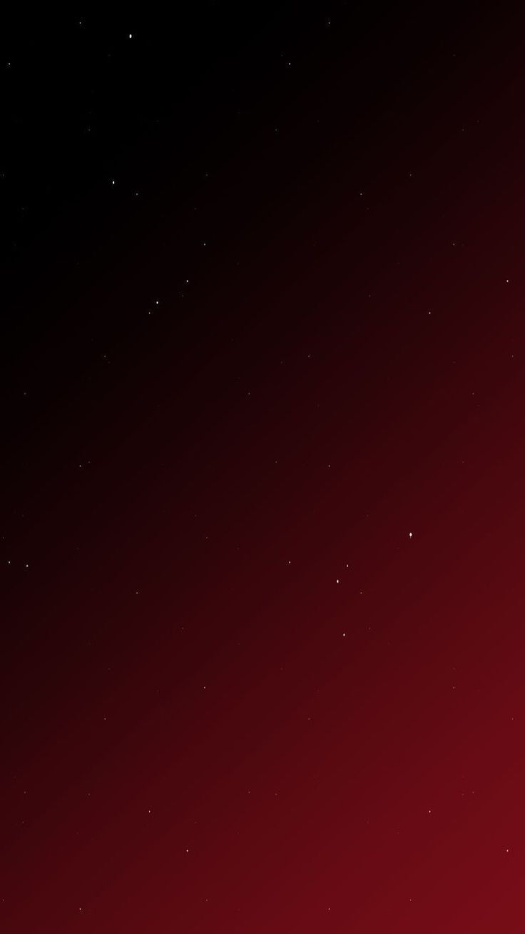 a red and black background with stars in the sky